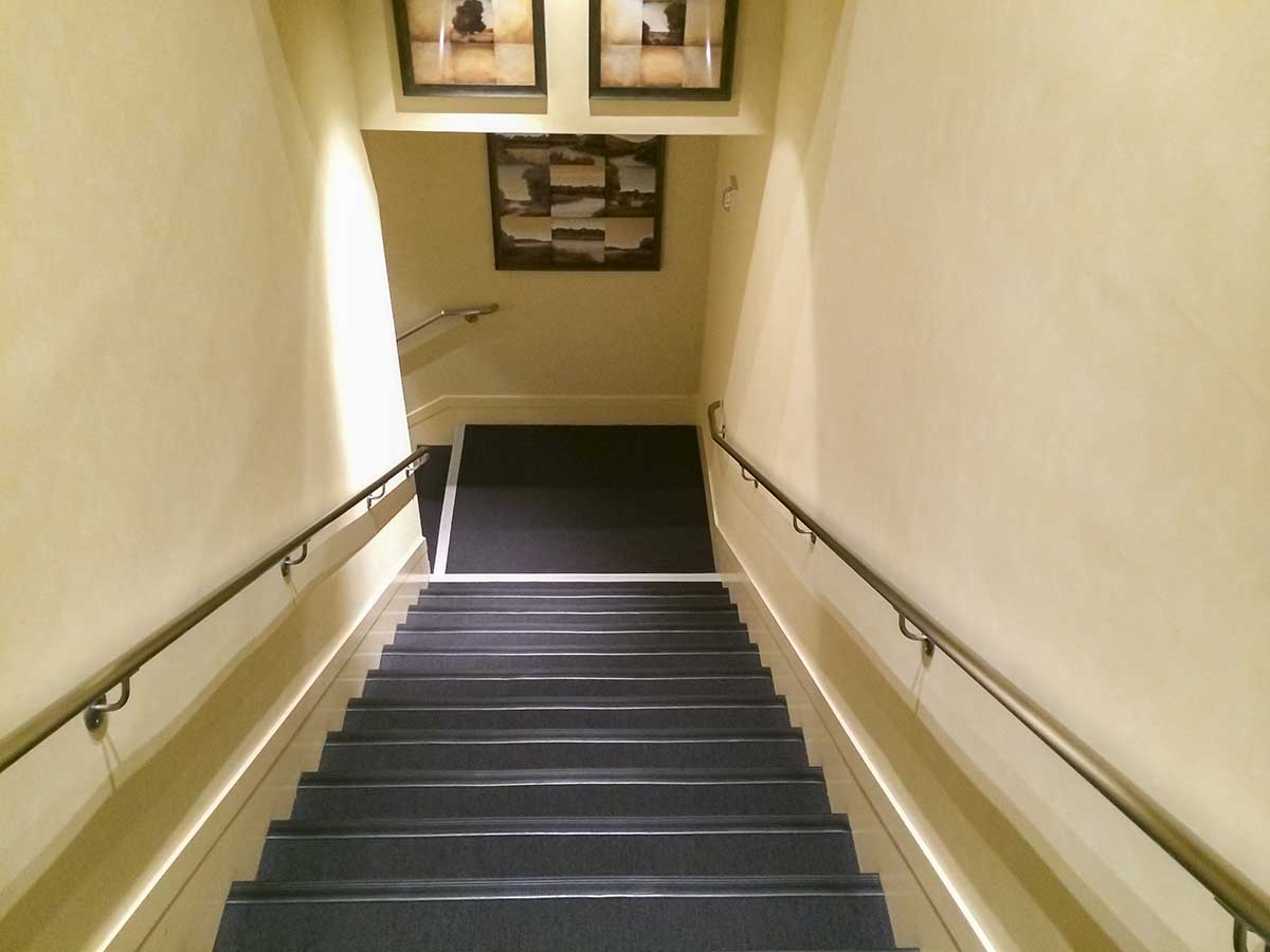 Stairs leading down to the United global first lounge SFO