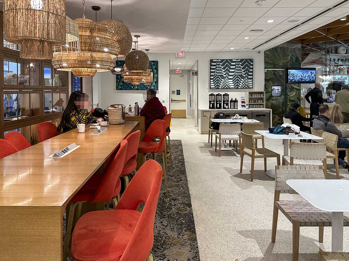 Seating areas inside of the Amex Escape Lounge FLL 