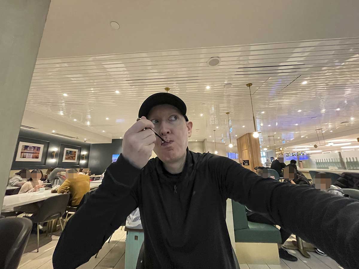Scott from LoungeJournal.com eating breakfast in the Plaza Premium Lounge YVR