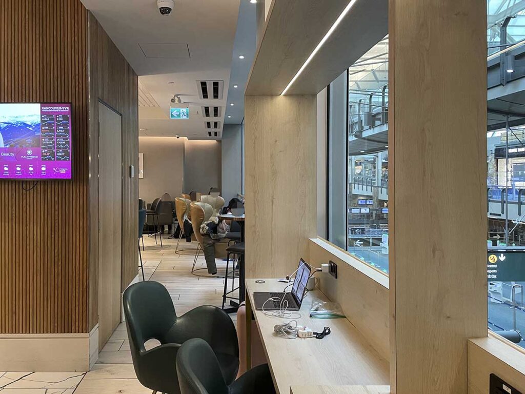 Plaza Premium Lounge YVR seating areas with windows looking out to the main terminal
