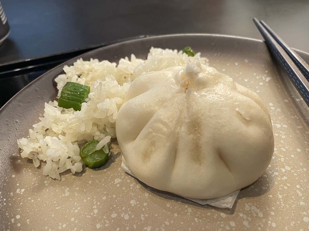 Dumplings and rice served in the Cathay Pacific The Pier Lounge Hong Kong