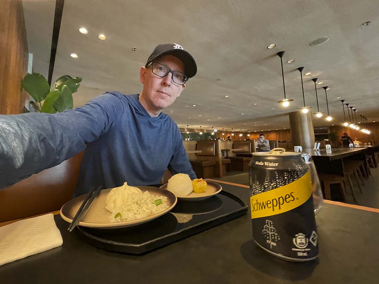 Scott eating fresh dumplings in the Cathay Pacific The Pier Lounge Hong Kong