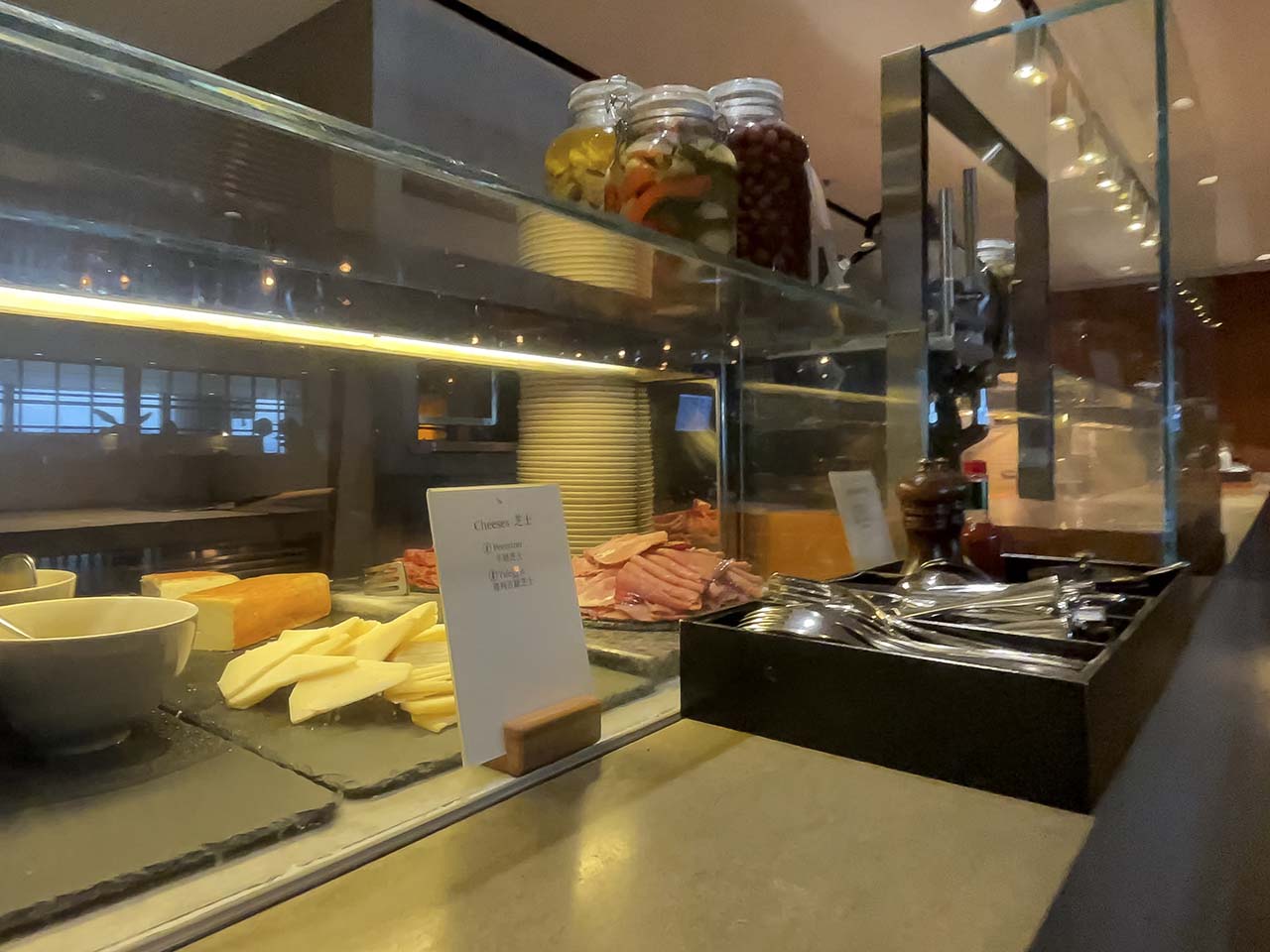 Deli with meat and cheeses inside the Cathay Pacific The Pier Lounge Hong Kong