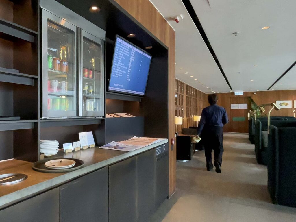 Snack station with drinks in the main seating area Cathay Pacific The Pier Lounge Hong Kong