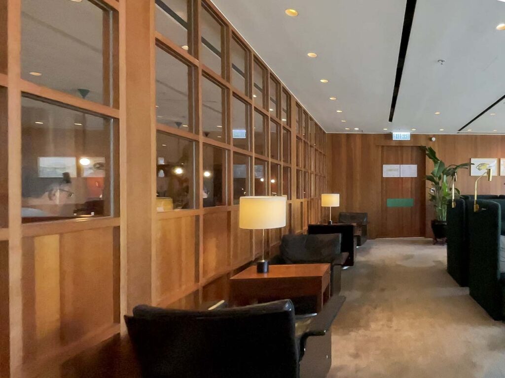 Natural wood paneling inside of the Cathay Pacific The Pier Lounge Hong Kong