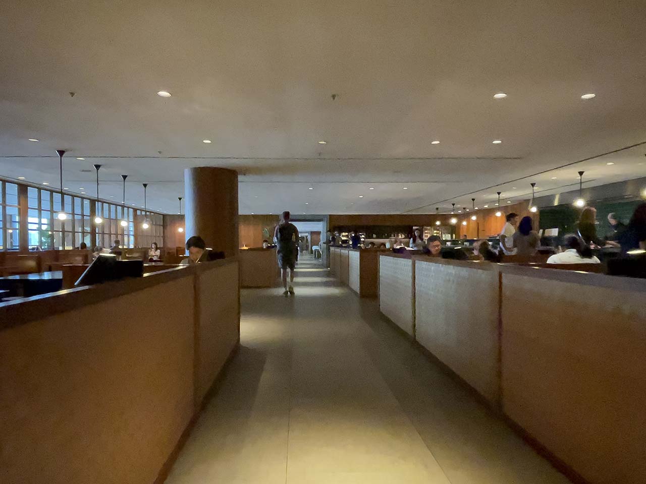Communal tables and chairs for eating in the Cathay Pacific The Pier Lounge Hong Kong