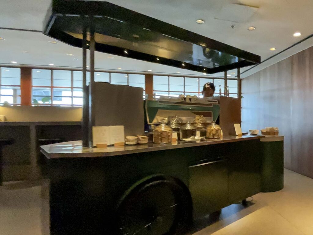 Snack cart with things like pretzels and potato chips in the Cathay Pacific The Pier Lounge Hong Kong