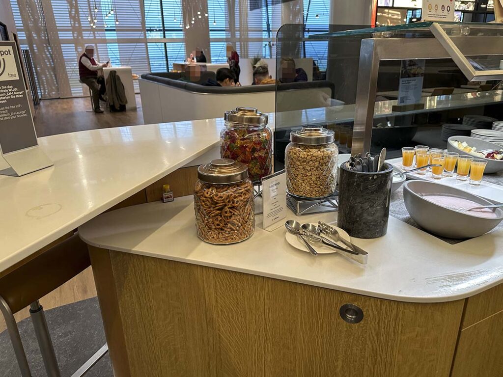 Lufthansa Lounge Heathrow Terminal 2 snack items such as pretzel and peanuts