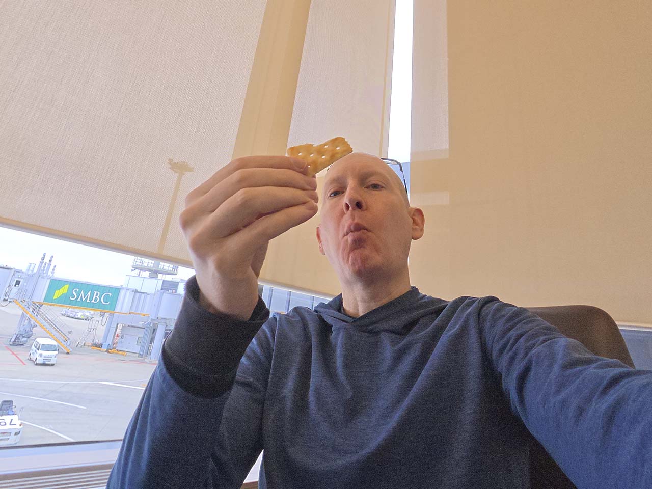 Scott eating saltine crackers in the Korean Air Lounge Terminal 1 Narita Airport