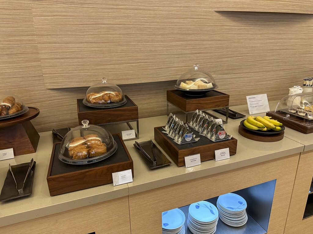 Rice balls, bananas, little sandwiches, and a variety of pastries in the Korean Air Lounge Terminal 1 Narita Airport