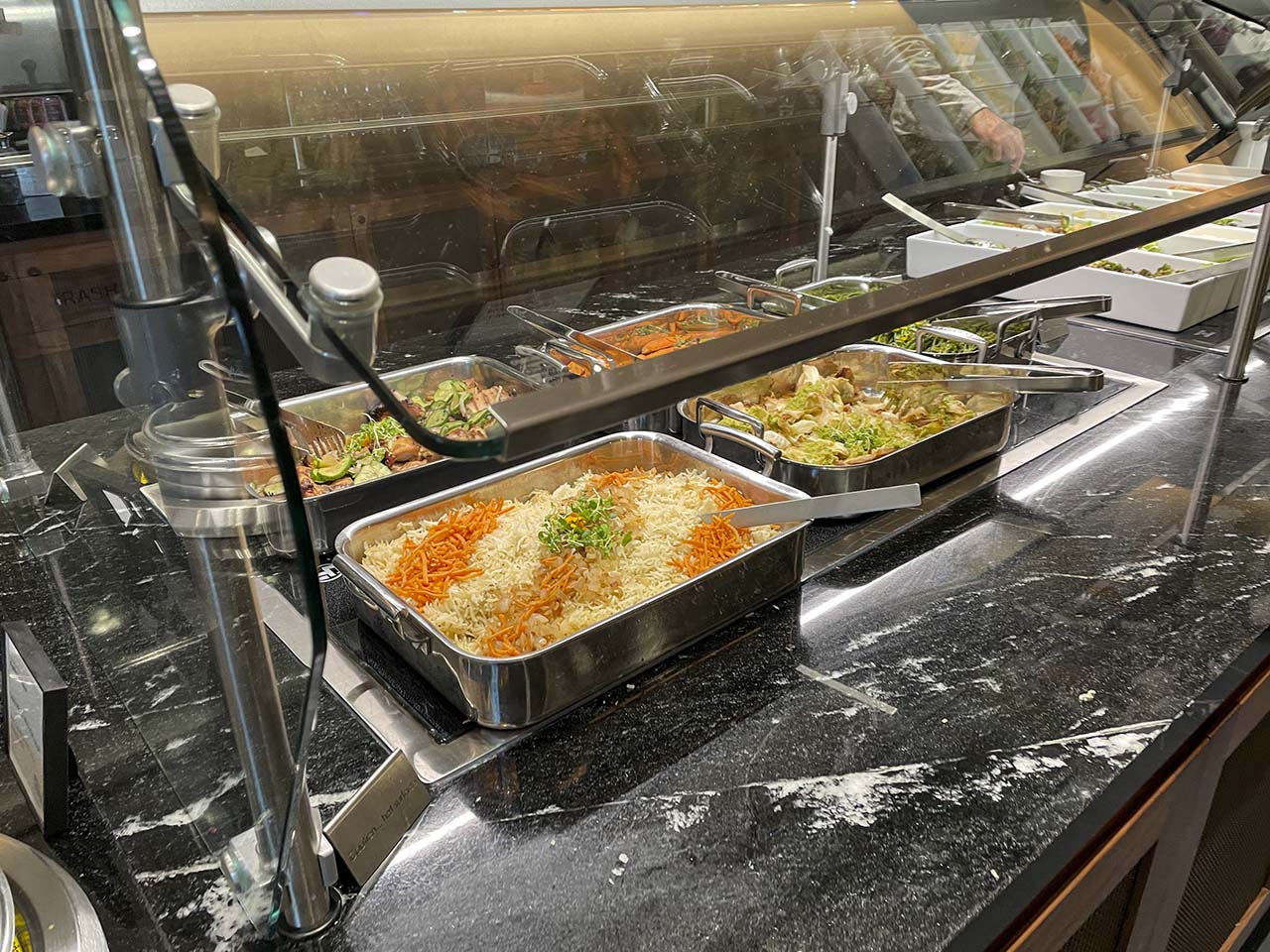 Freshly prepared hot food items in the SLC Amex Lounge