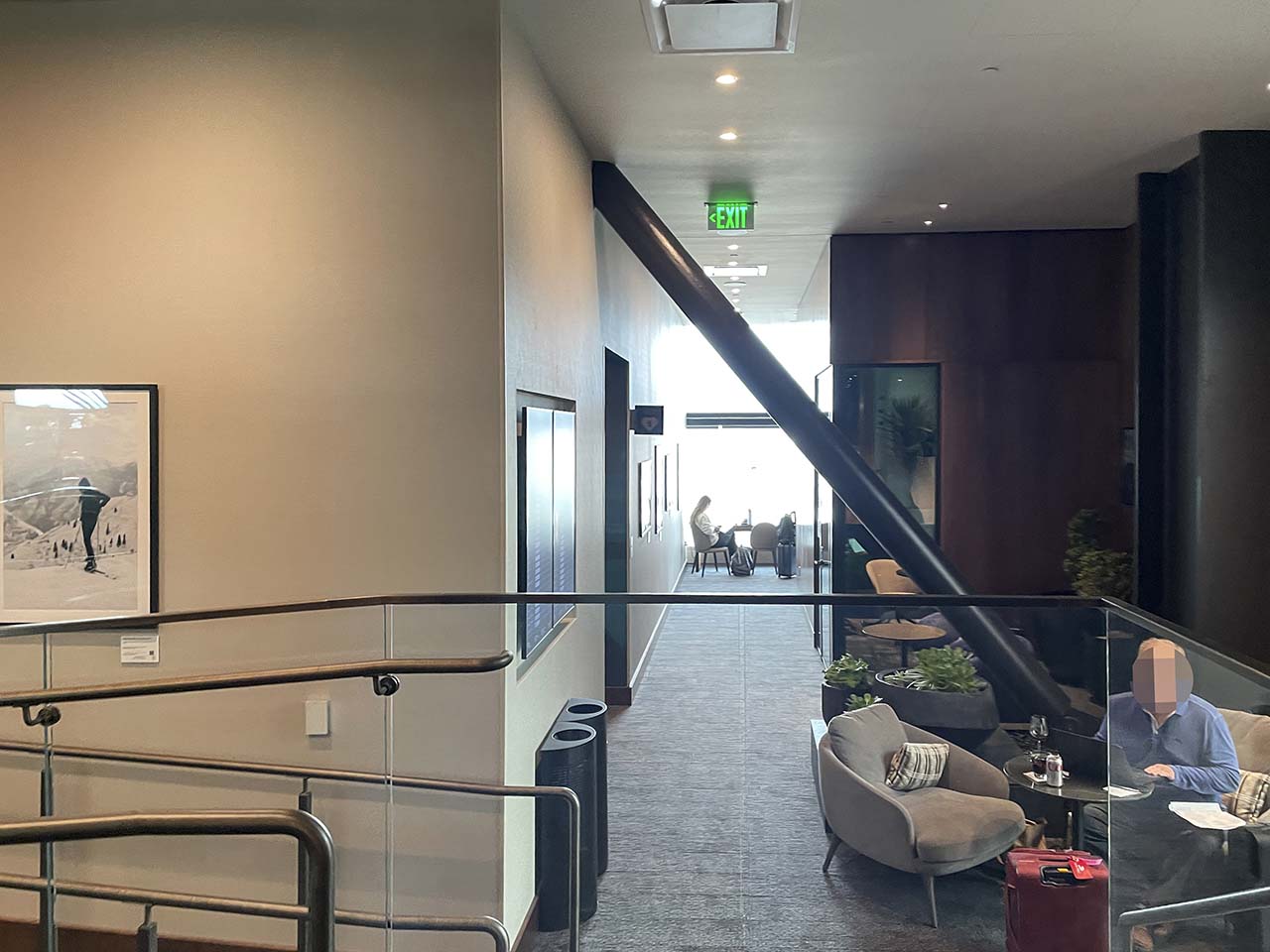 Stairwells and walkways with seating areas inside the SLC Amex Lounge