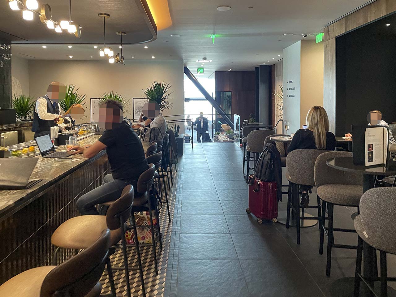 Seating area inside the bar at the SLC Amex Lounge